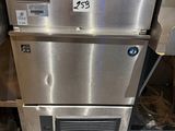 a stainless steel dishwasher that is sitting on a counter