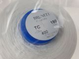 a spool of thread in a plastic container