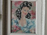 a painting of a woman in a blue dress in a white frame