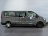 the grey van is parked on the concrete floor in the room