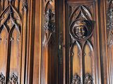a large wooden cabinet with carvings on it