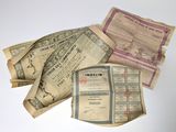 several old indian bank notes are stacked on top of each other