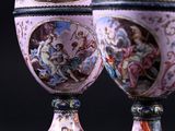 two vases that are sitting on a table
