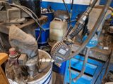 a machine that is sitting on a table in a garage