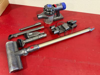 several different types of vacuum cleaners on a red surface
