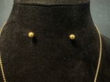necklace and earring set in gold tone with pearls on a mannequin