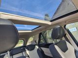 a view of the sunroof from inside of a car