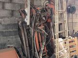 a pile of old tools and tools in a garage