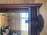 a mirror that is hanging on the wall in the room