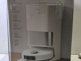 boxed box of a white coffee maker sitting on top of a table