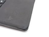 a close up view of a laptop keyboard on a white surface
