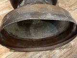 an old pair of shoes that are on the floor
