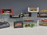 many different models of cars on display in a display case