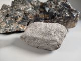 some rocks that are sitting on a white surface