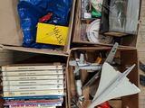 a box full of books and a paper airplane in it