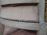 a close up view of a chair with buttons on the back