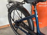 a bicycle that is parked next to a sign