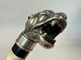 a close up of a metal object on a stick