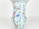 a vase with a bird and flowers painted on it