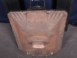 a piece of luggage sitting on the floor next to a chair