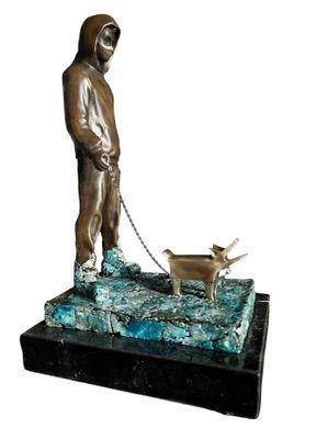 bronze statue of a man with a dog on a chain