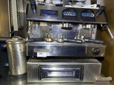 a coffee machine that is sitting on top of a counter
