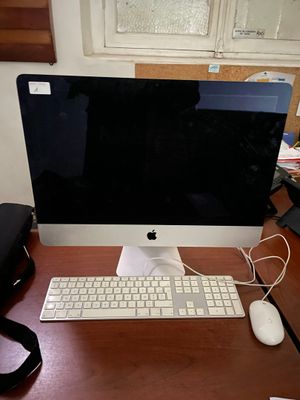 an image of a computer monitor and keyboard on a desk