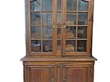 an image of a wooden china cabinet with glass doors