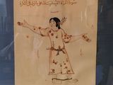 a drawing of a woman in a dress on the wall