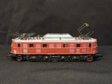 a red and white train car on a black background