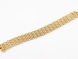 a close up of a gold chain bracelet on a white background