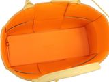the inside of an orange handbag with a strap