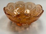 yellow glass bowl on a white table with a white background