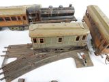 several toy trains are lined up next to each other on the tracks