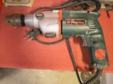 a drill that is sitting on top of a table
