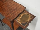 a small wooden table with a drawer on it