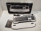 a computer keyboard and mouse sitting on a table