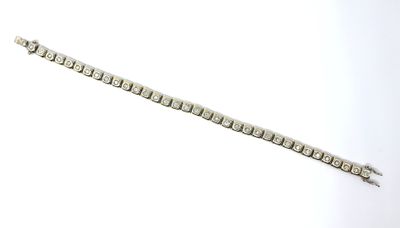 an image of a silver bracelet with a diamond clasp on a white background