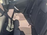 the back seats of a car with a seat belt in a parking lot