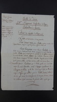 an old document with writing on it sitting on top of a table