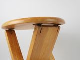 an image of a wooden stool with two legs and a wooden seat