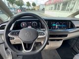the interior of a car with a steering wheel, dashboard, and display screen