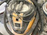 two vacuums that are sitting next to each other