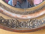 a man taking a picture of himself in a mirror