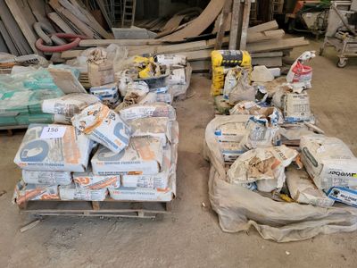 many boxes of construction materials sitting on a pallet in a warehouse