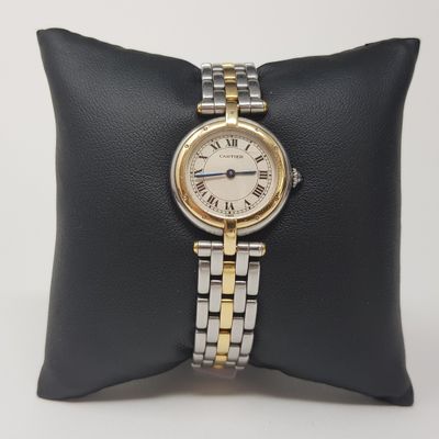 an image of a woman ' s wrist watch on a pillow