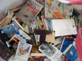 a bag full of books sitting on top of a table