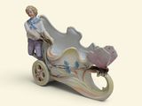 a figurine of a man riding in a carriage