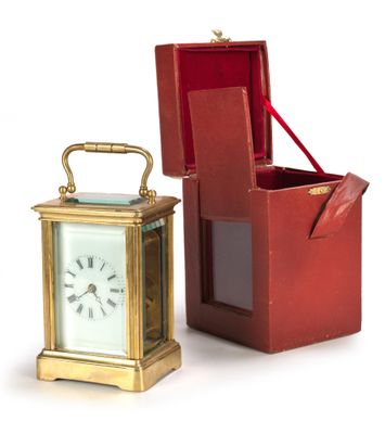a small red box with a clock inside of it