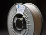 une bobine de filament posée sur une surface noire